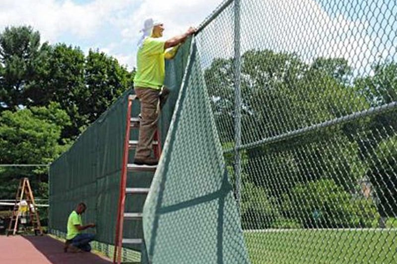 Windscreen on a softball outfield fence