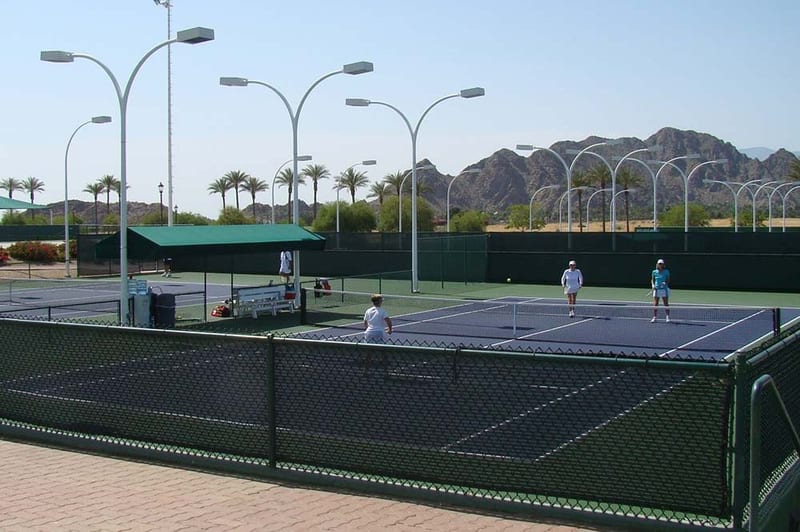 Windscreen installed on the back fence of a tennis court